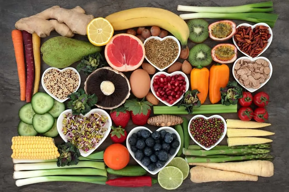 Heart-shaped bowls filled with colorful whole foods